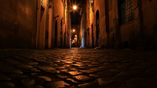 cobblestone back street at night