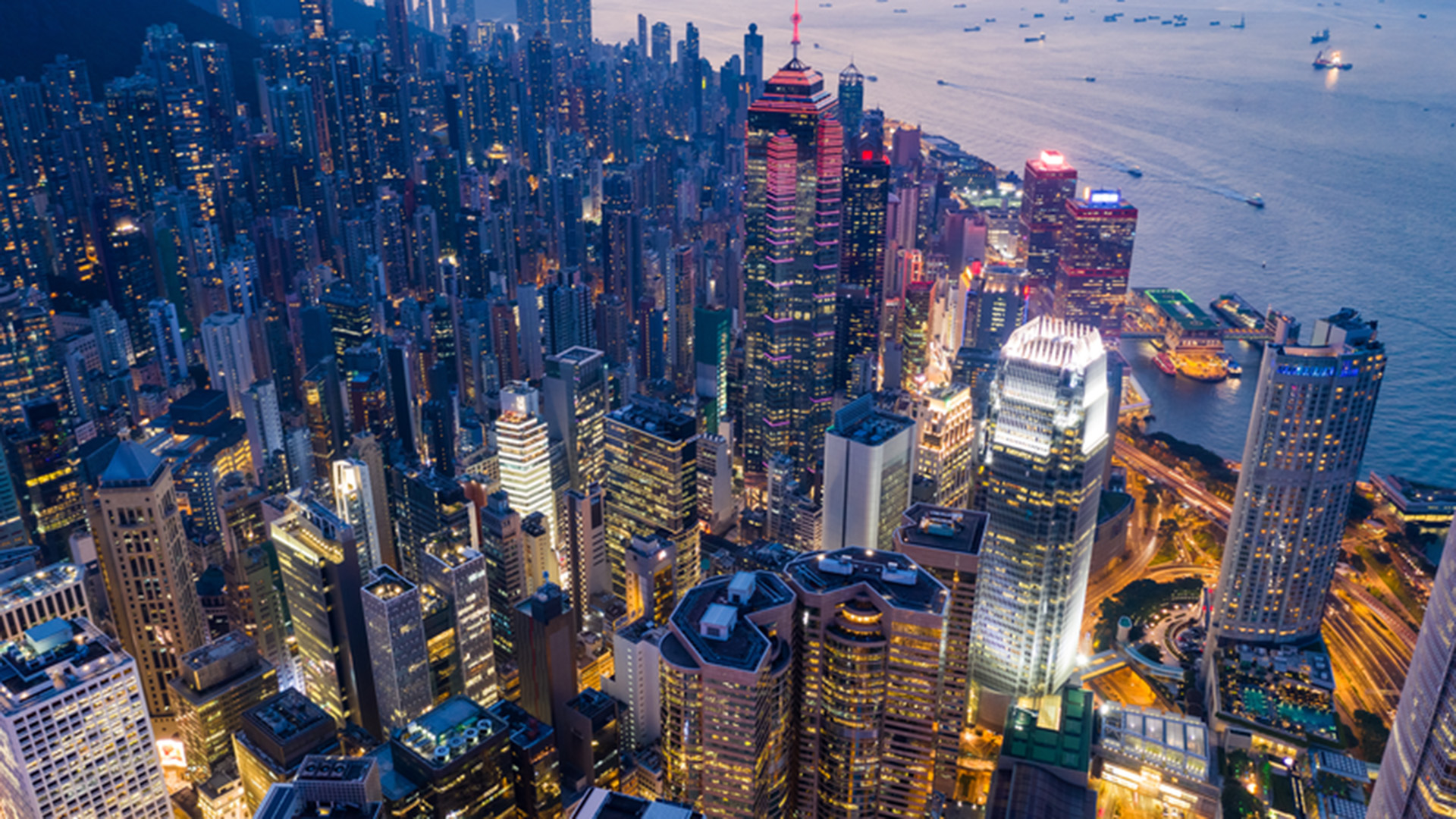 Hong Kong skyline shown at evening time from dynamic overhead angle