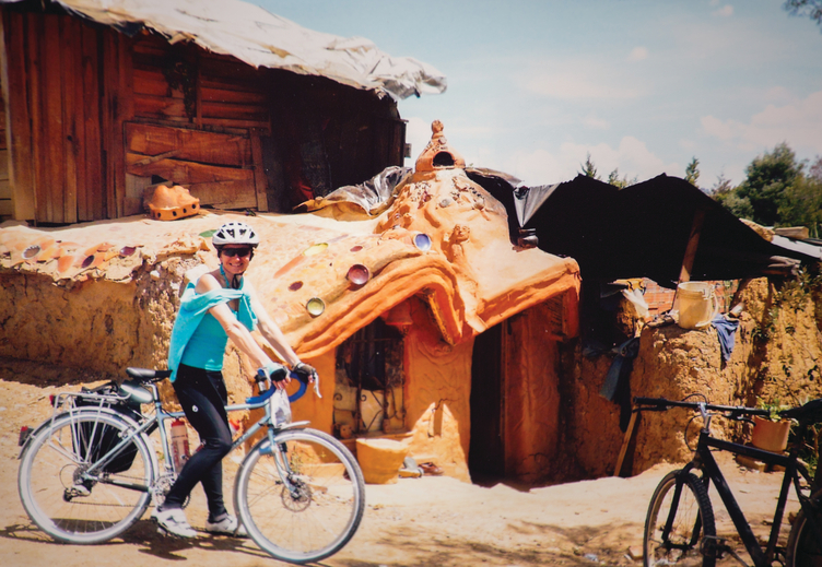 Miriam Davies with her bike in a remote village