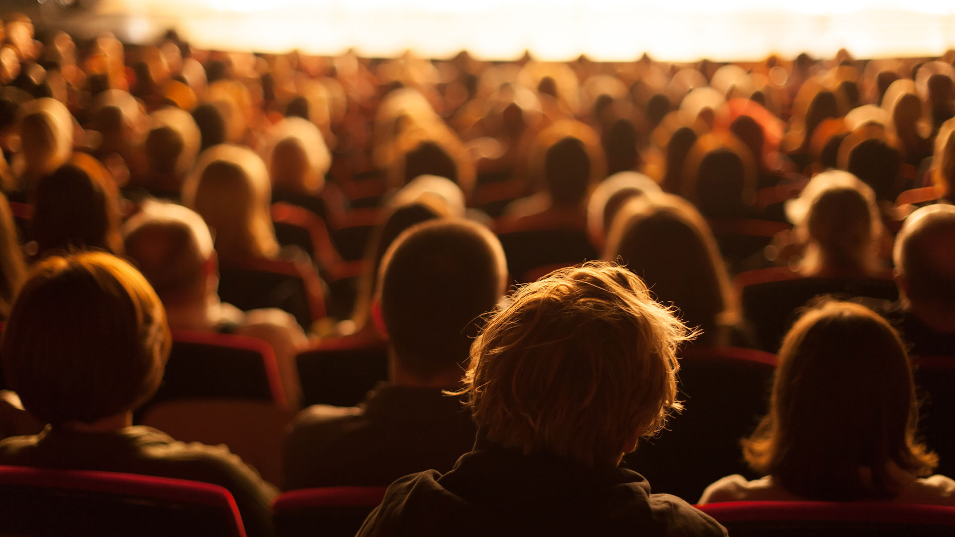 audience sitting at theatre
