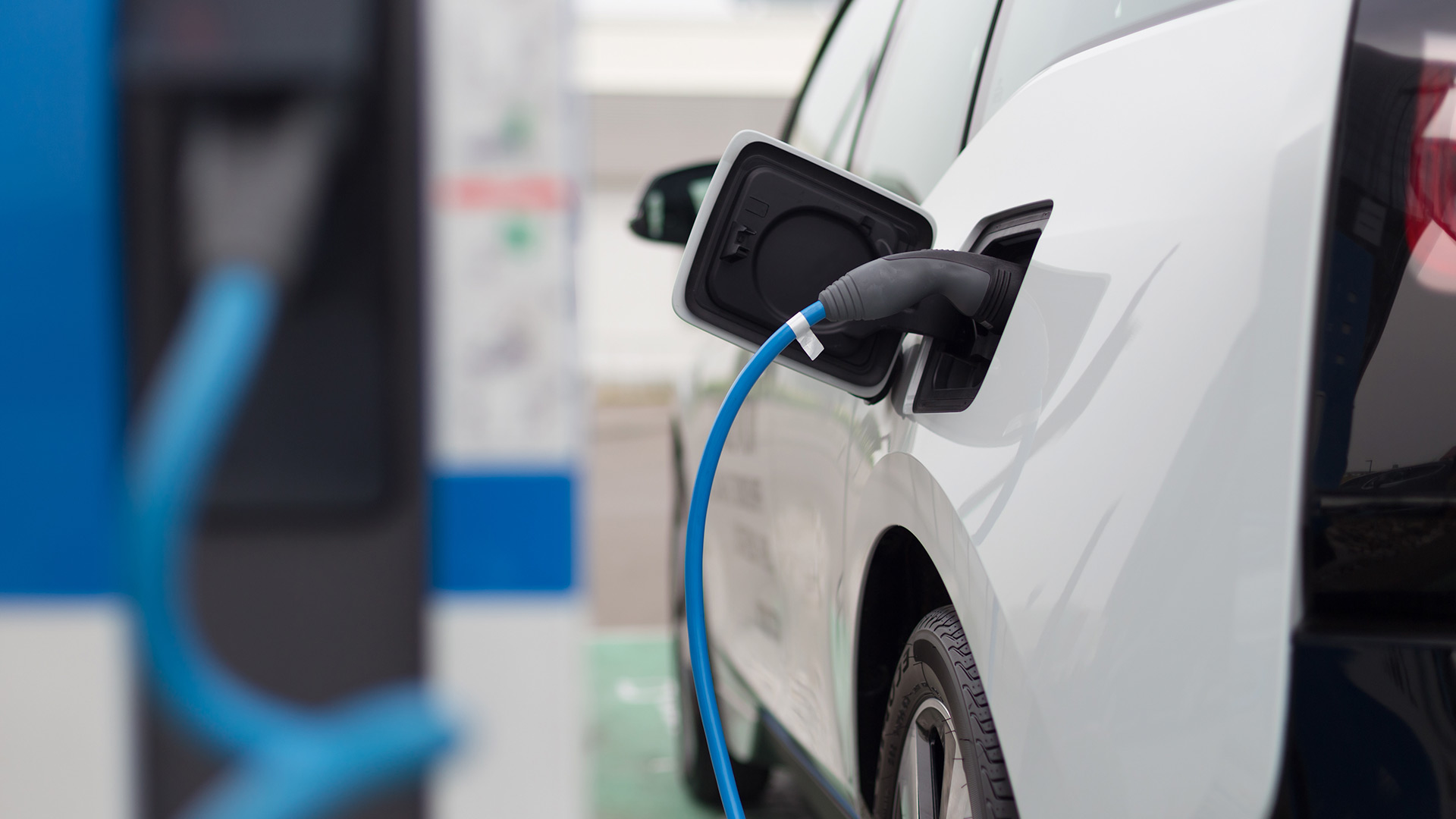 Electric car charging at station