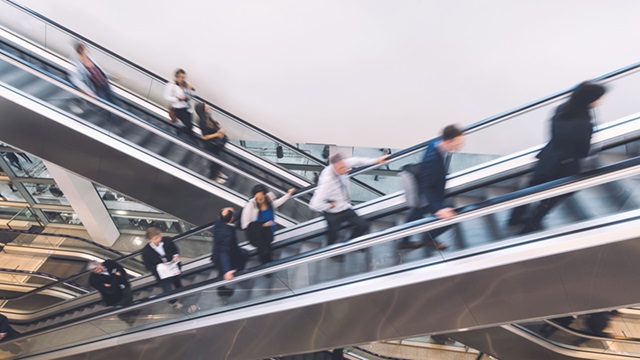 Employees on an escalator