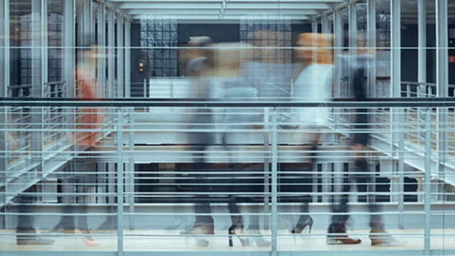 Employees pass on a corporate landing