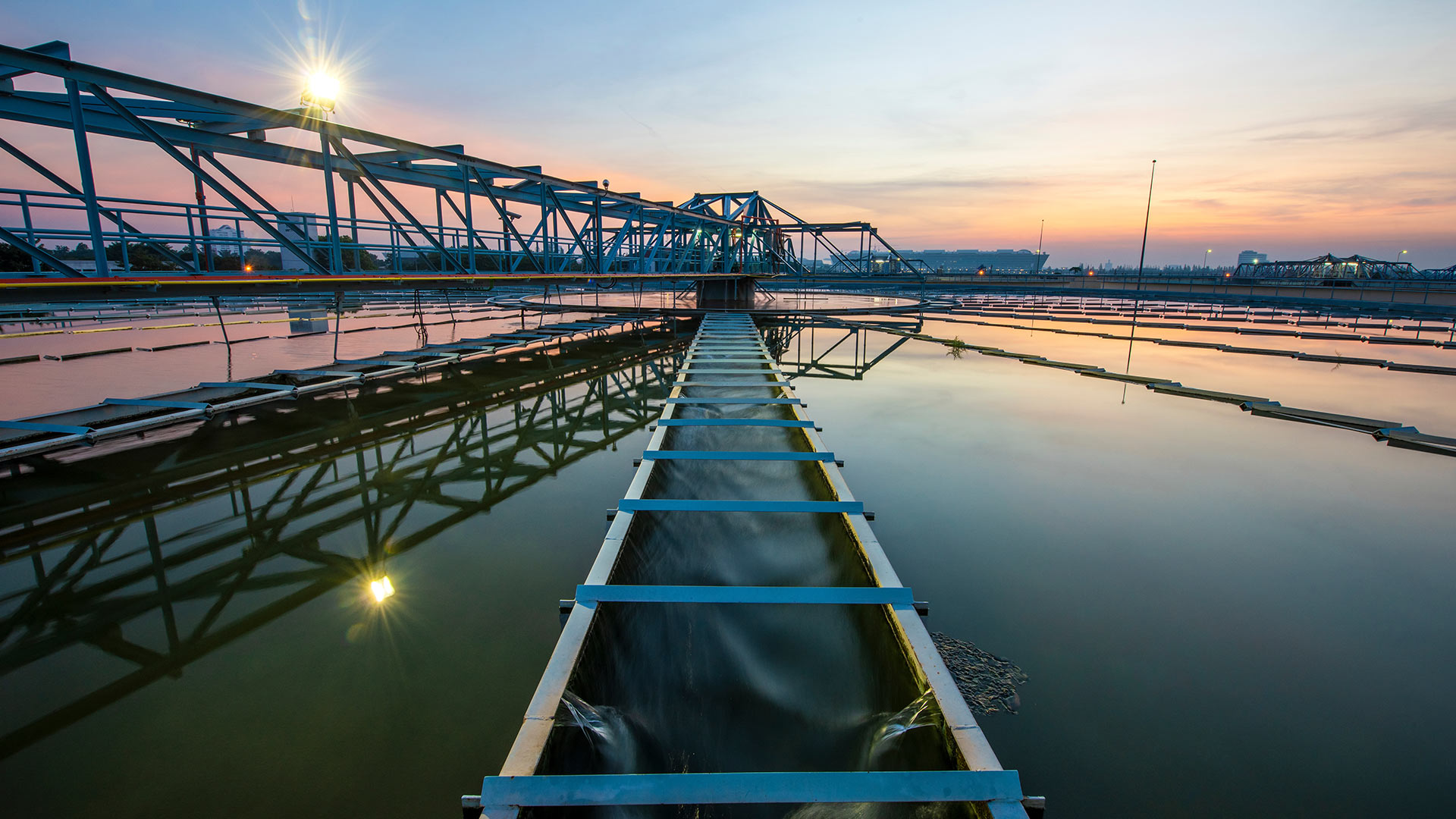 Bridge over water at sunrise