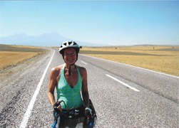 Miriam Davies on her bike, the long road stretching behind her