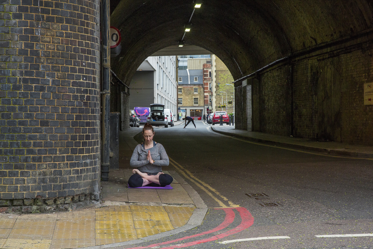 Tina doing yoga under a bridge in Bermondsey in south London, for RE issue 11
