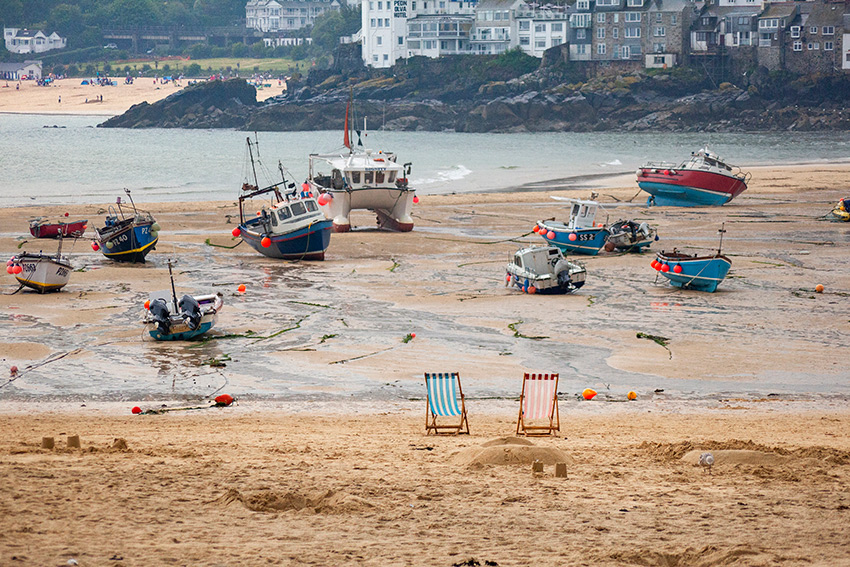 Cornwall beach with boats on the sand