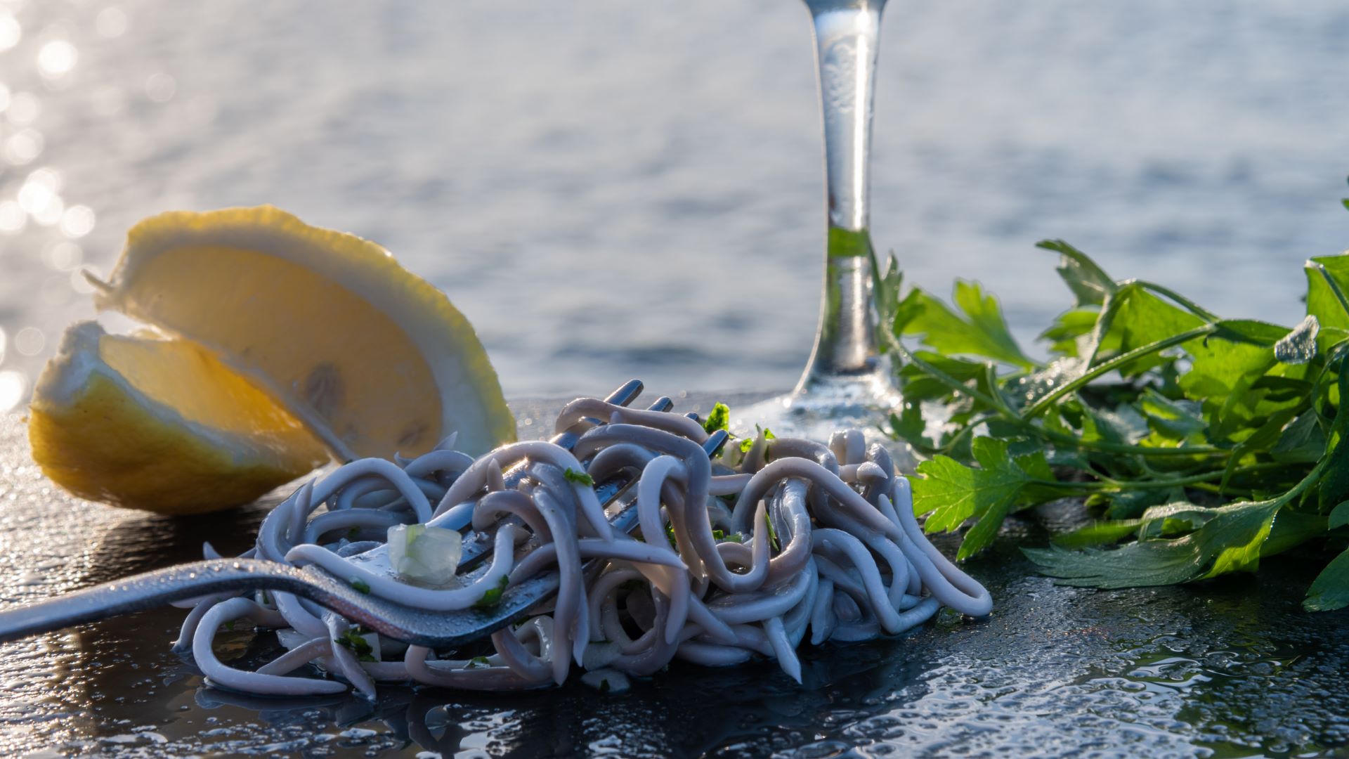 glass eels with a lemon