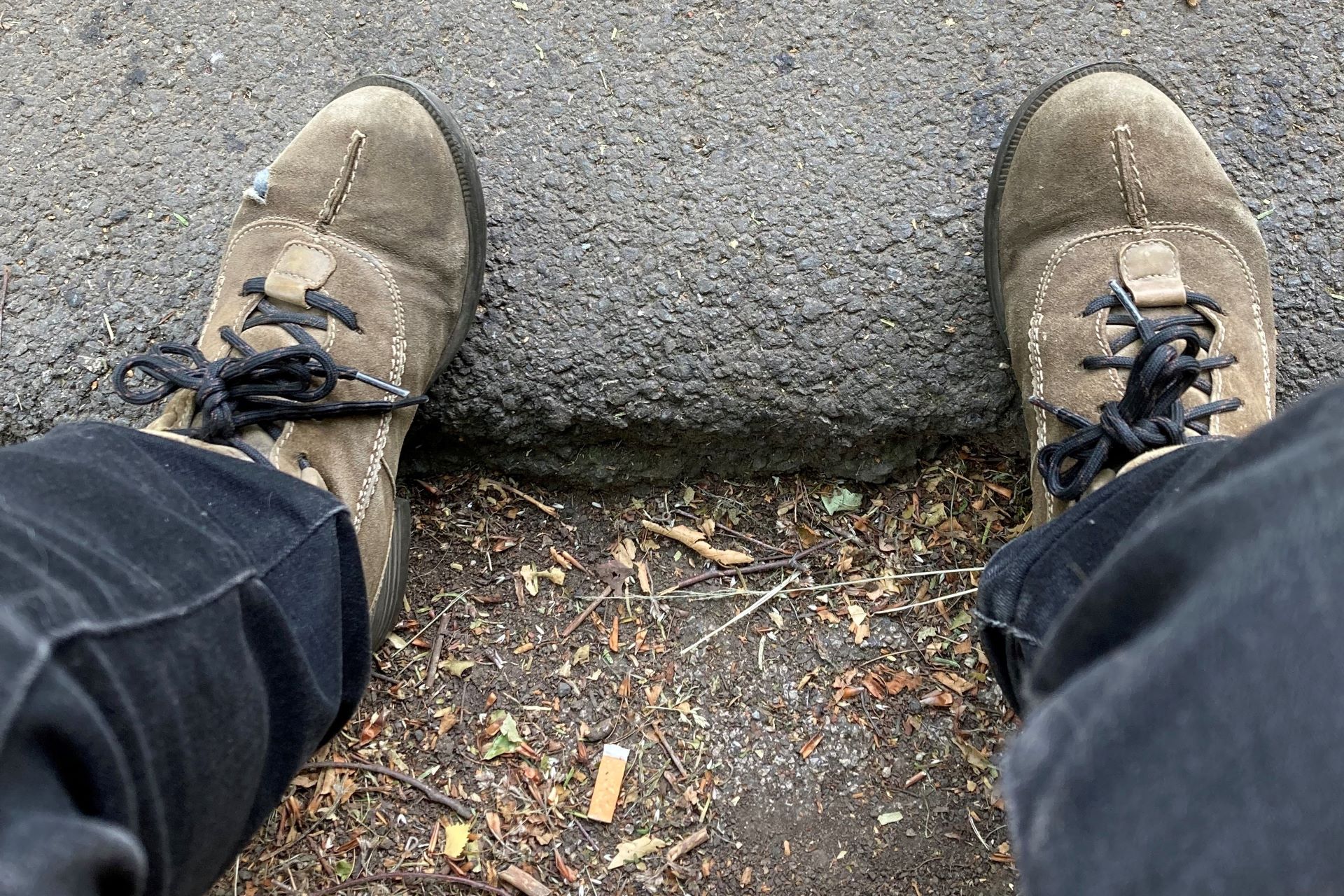 old shoes, old jeans, tired pavement