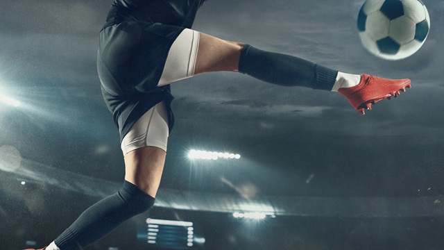 A player volleys a football