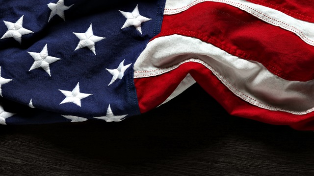 American flag resting on a wooden surface