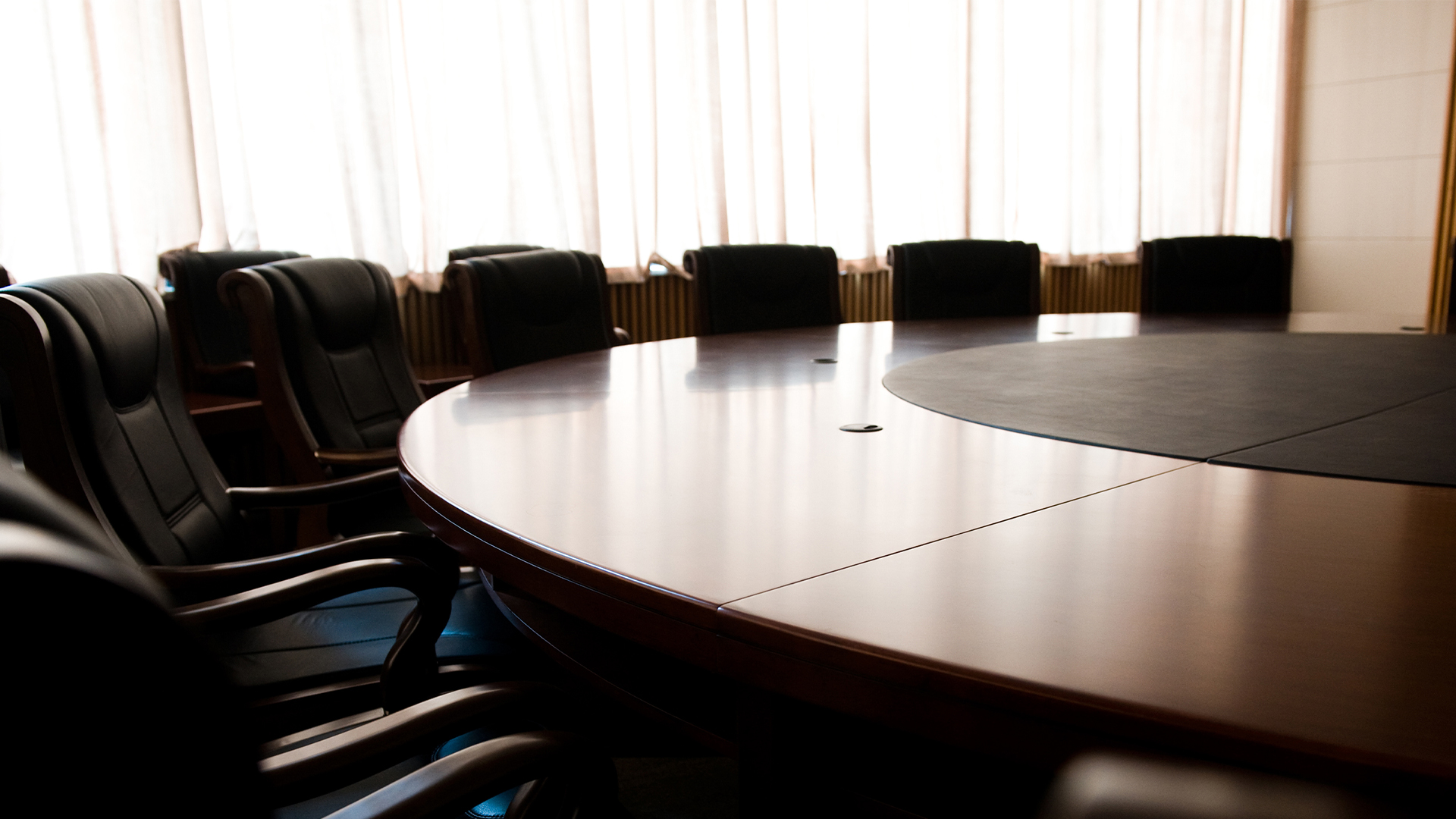 Board-directors-meeting-planning-panel-chairs-table