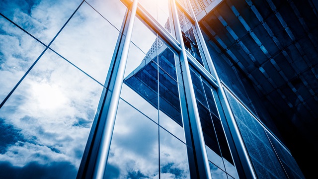 windows with clouds reflected in them