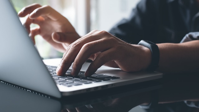 Employement-labor-laptop-keyboard-working-online-AdobeStock_236629968