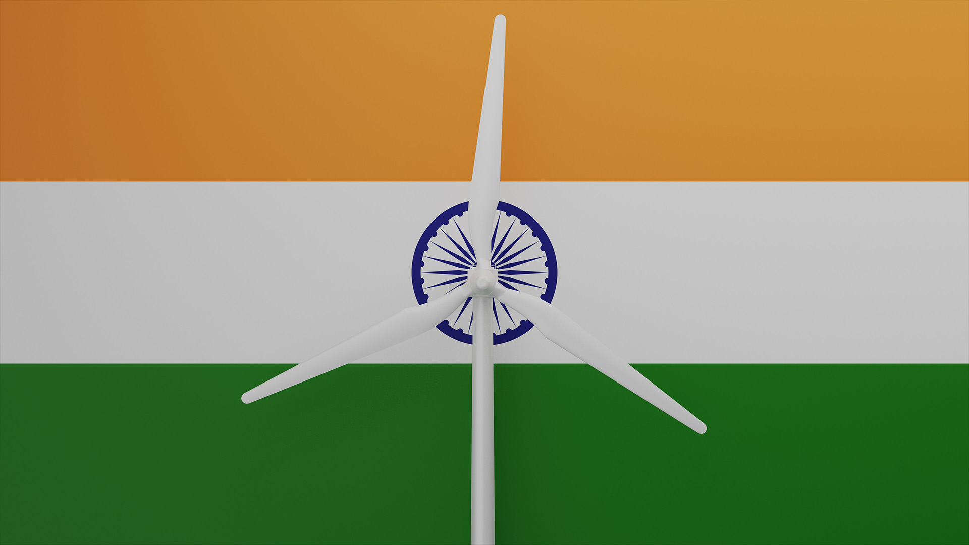 Large wind turbine in center with a background of the country flag of India
