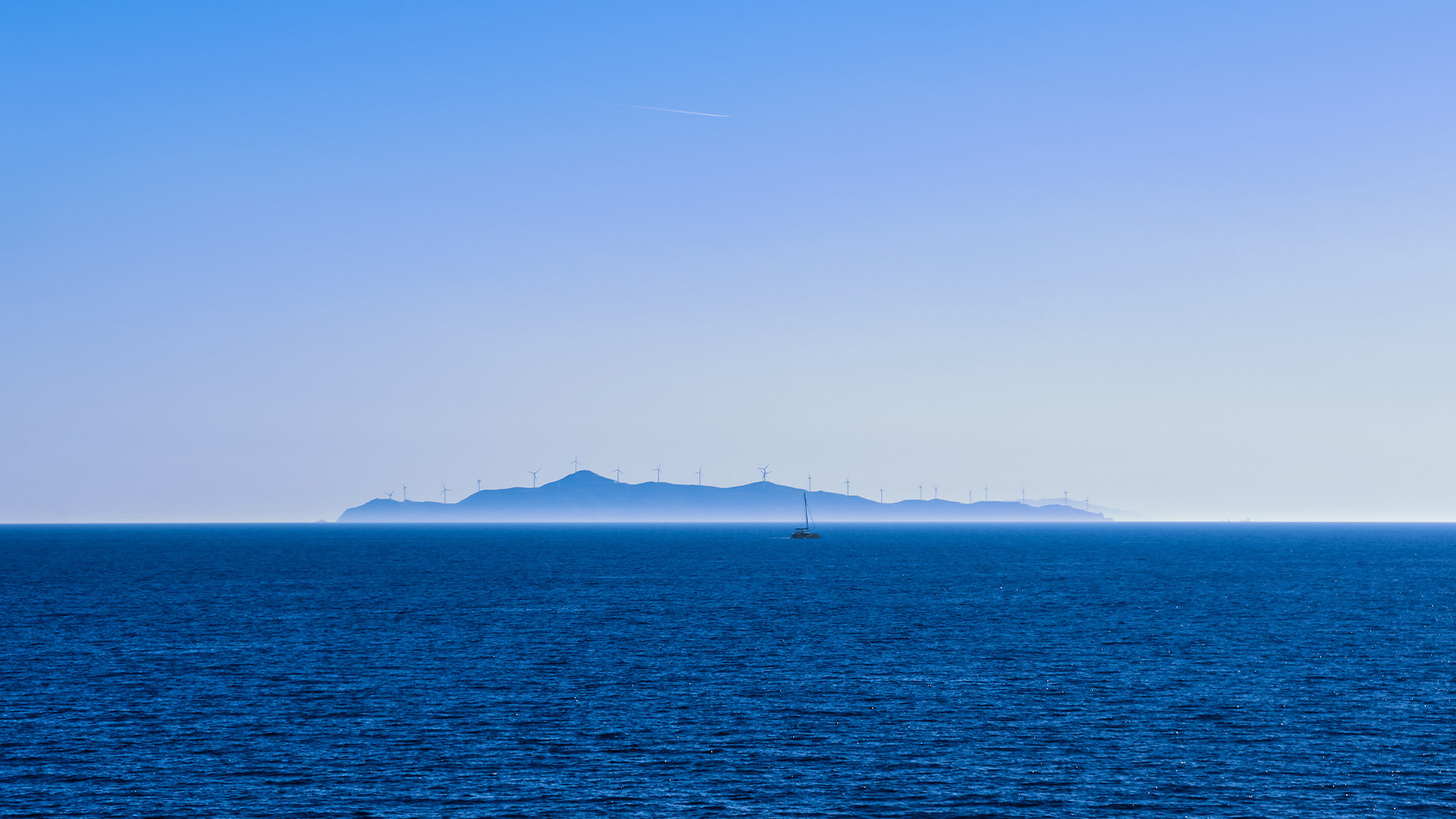 Seascape of calm azure sea and blue sky no clouds