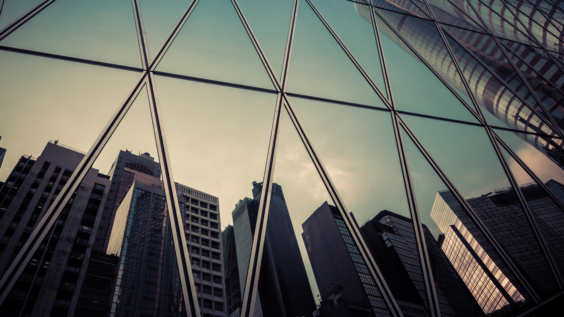 reflections of buildings in a window