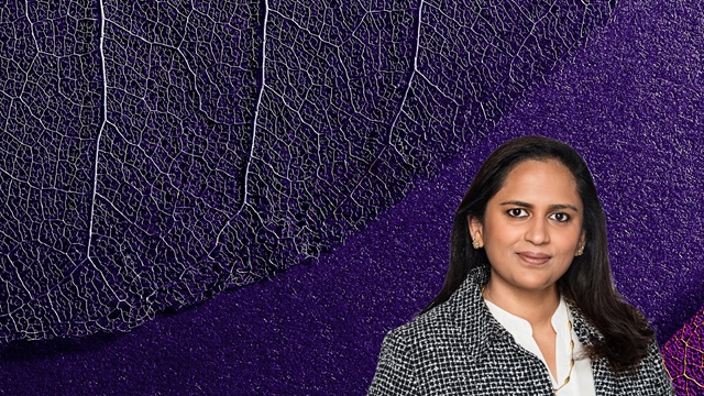 Aarti Thadani in front of a purple leaf background