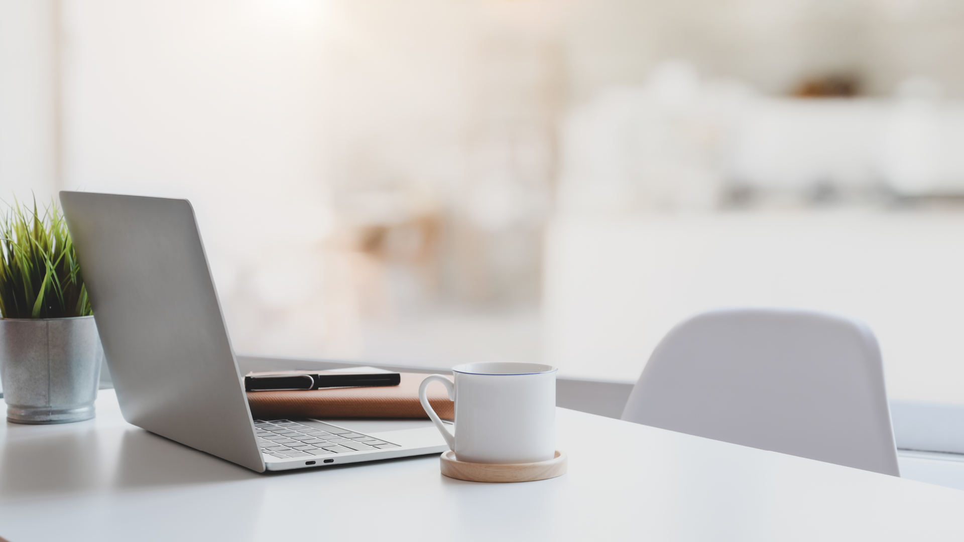 laptop on white table