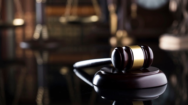 Law gavel resting on a desk