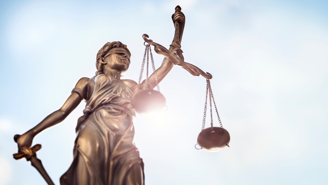 liberty statue holding scales