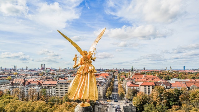 Golden statue over skyline