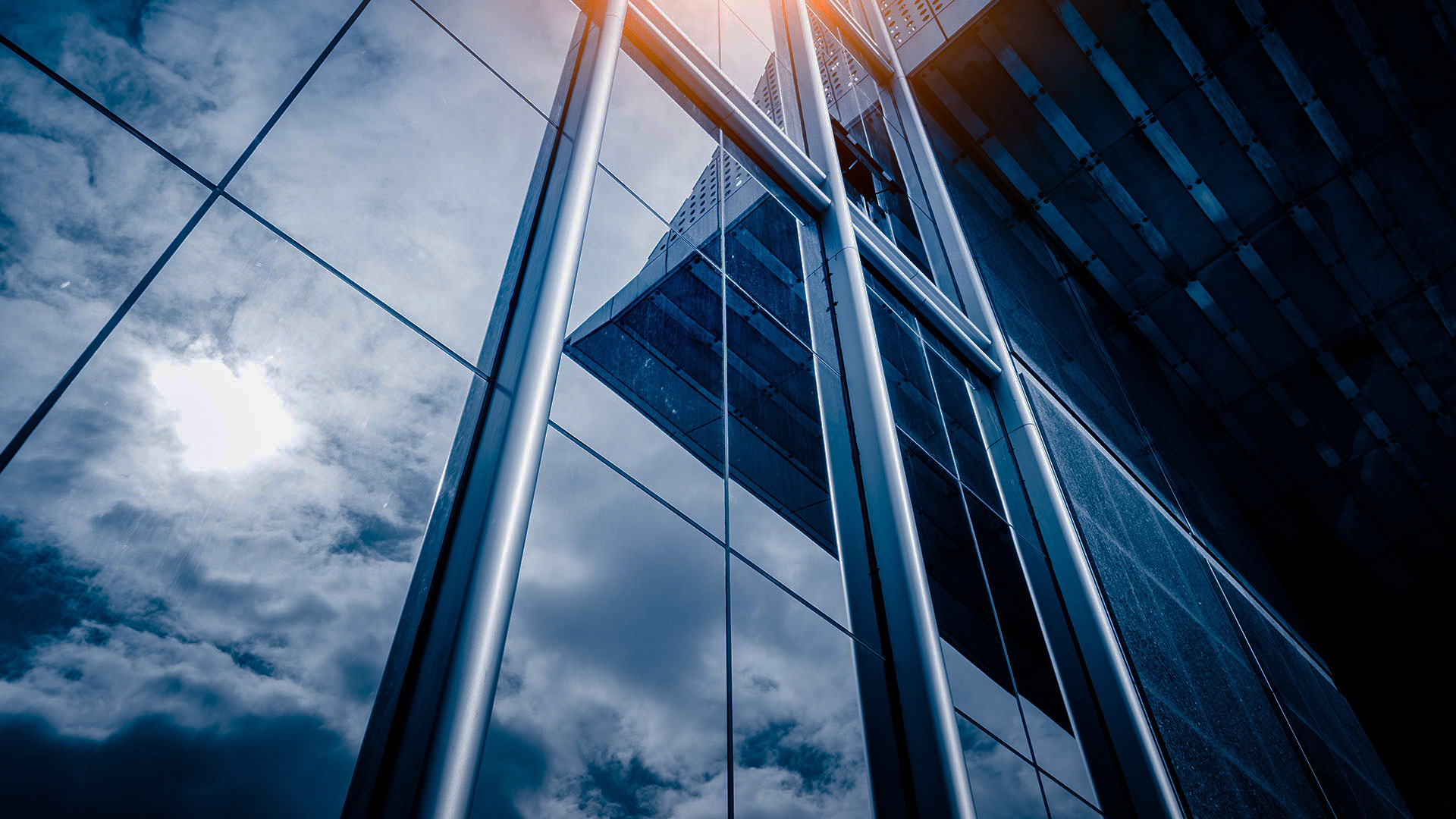 Modern architecture building's windows with sun reflection