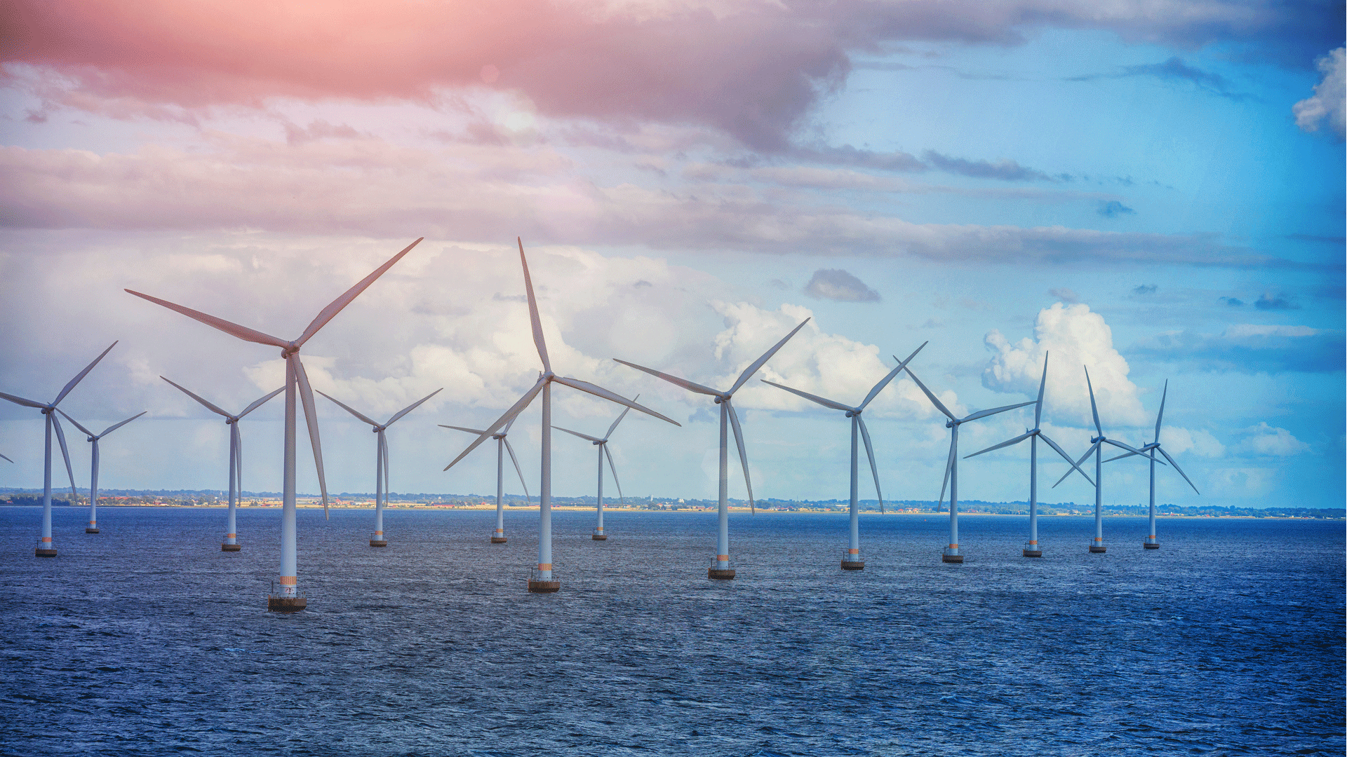 windmills on the shore