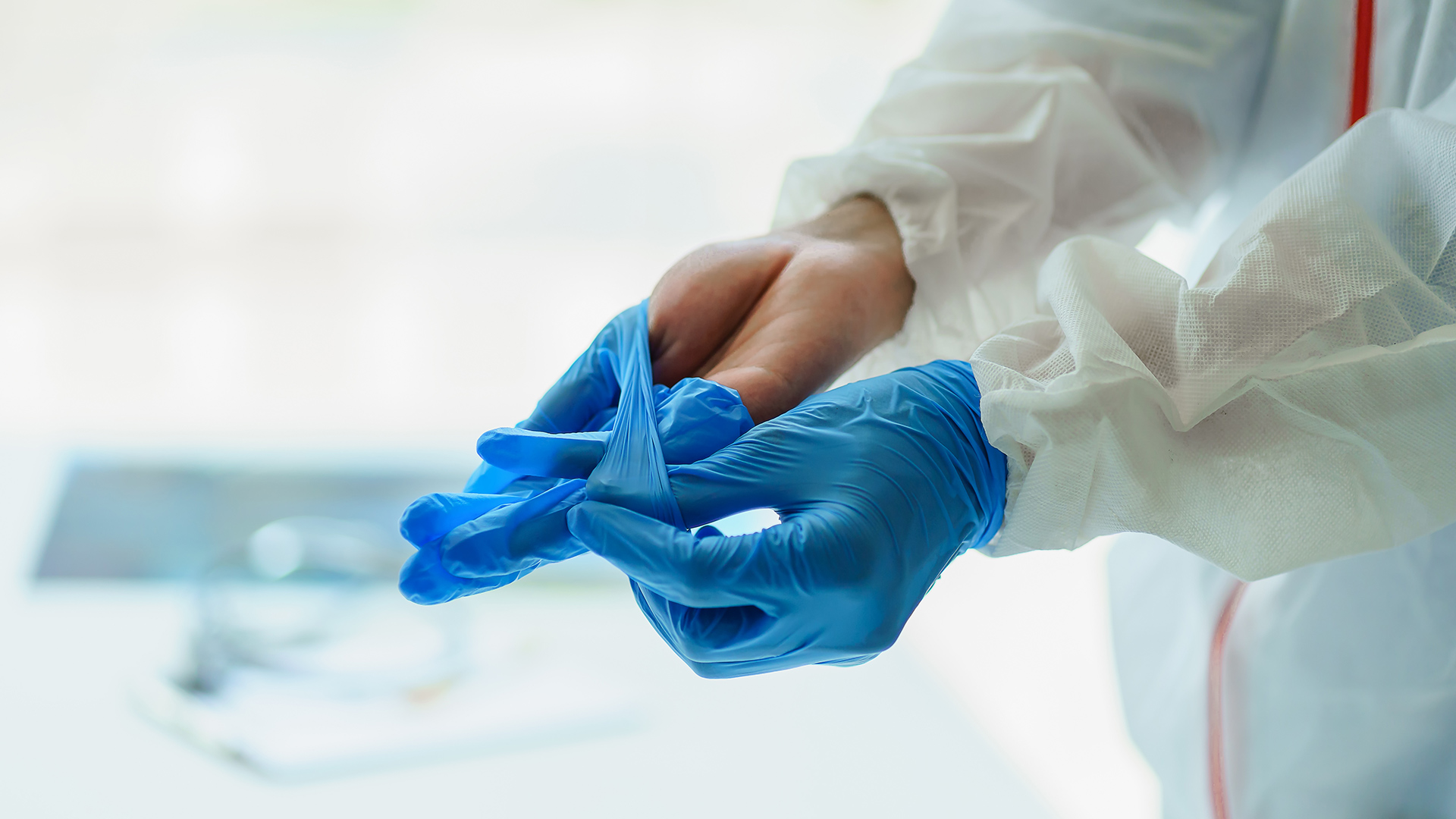 Person removing surgical gloves