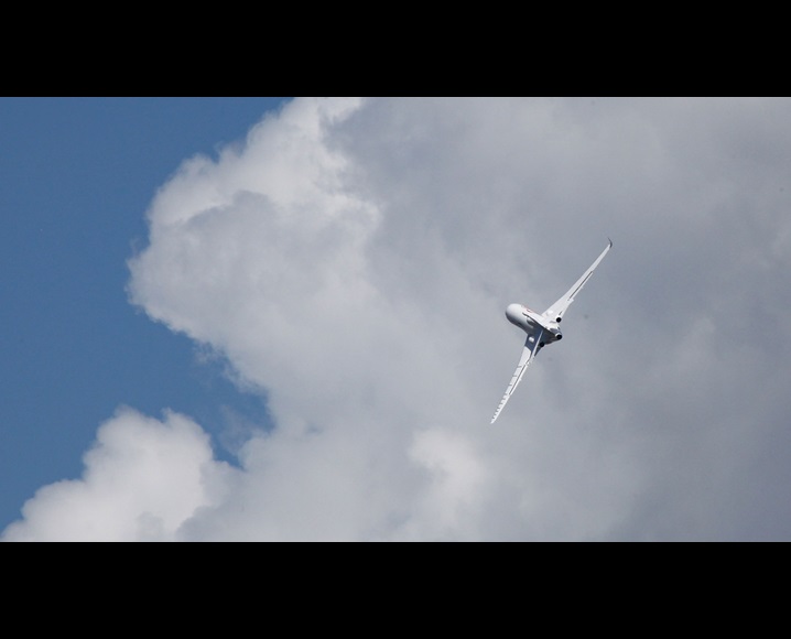 Plane flying near clouds