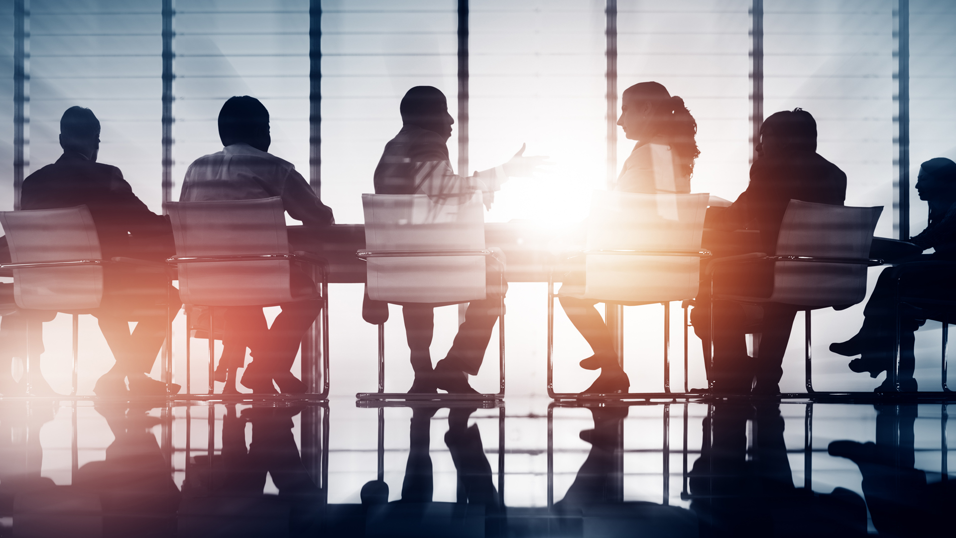 A row of people in conference room