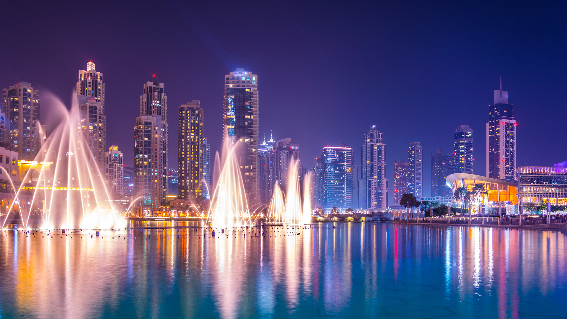 Skyscrapers with fountains at night