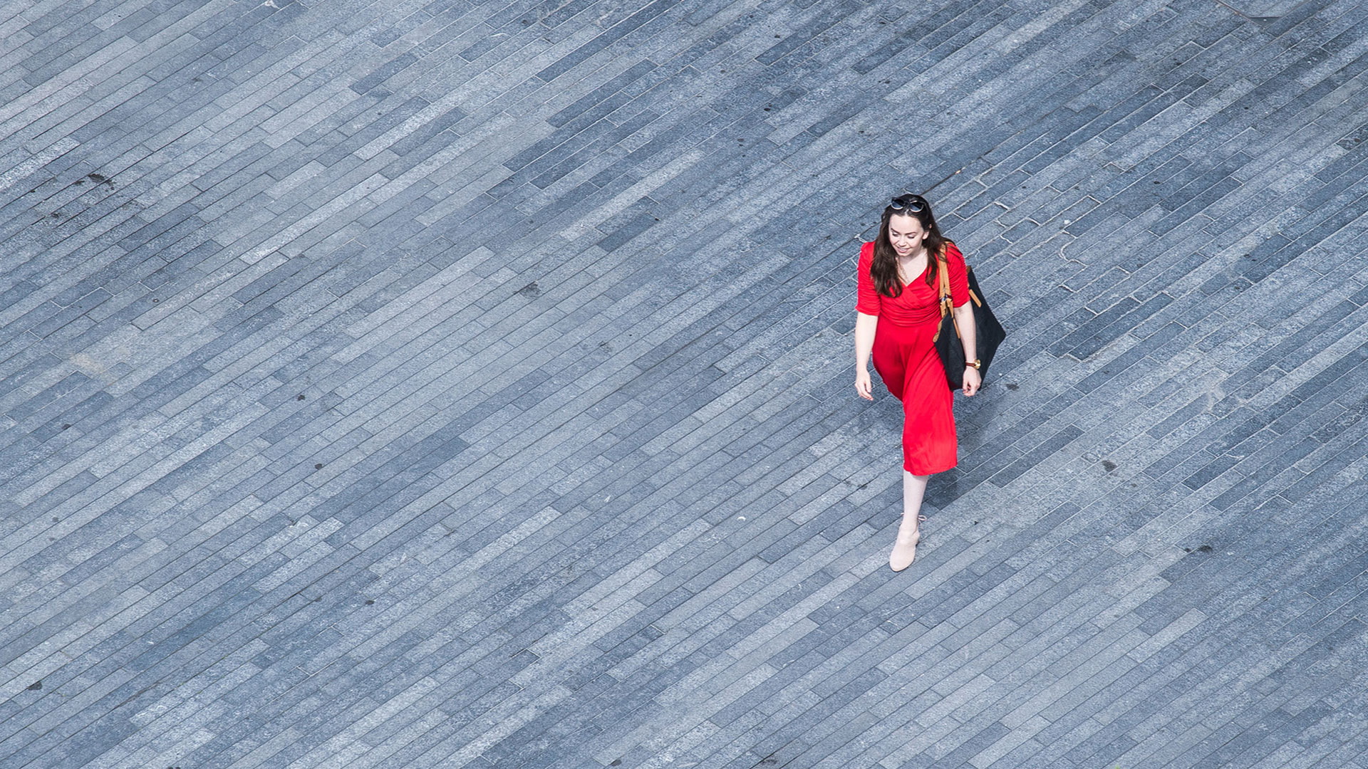 Woman walking on pavement