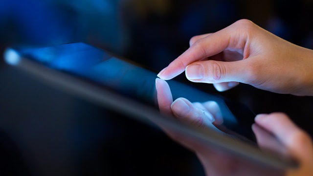man holding digital tablet