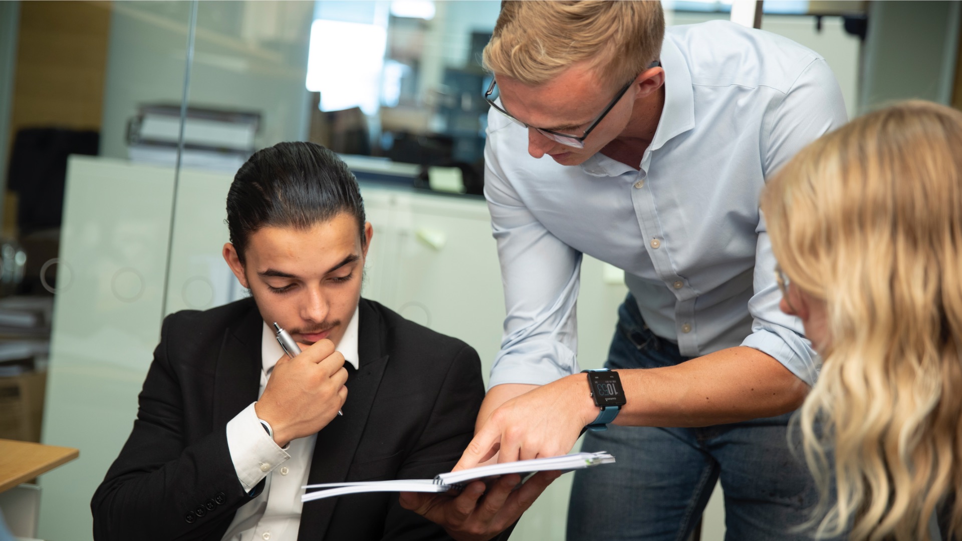 man teaching his colleagues