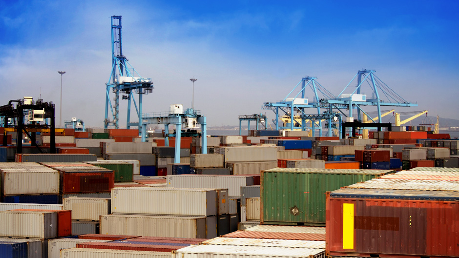 Hundreds of shipping containers on a shipping dock