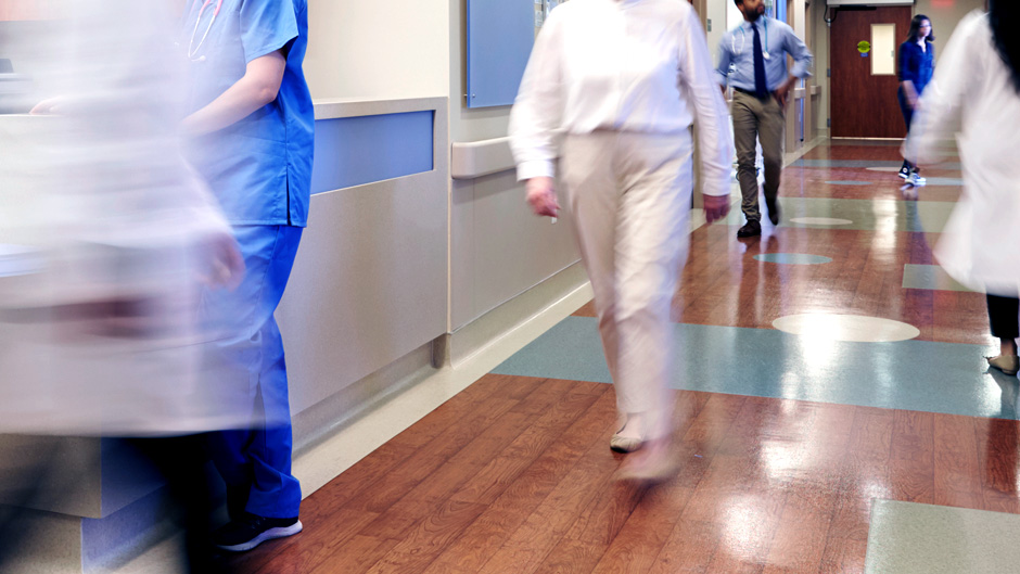 Healthcare workers walking in hospital