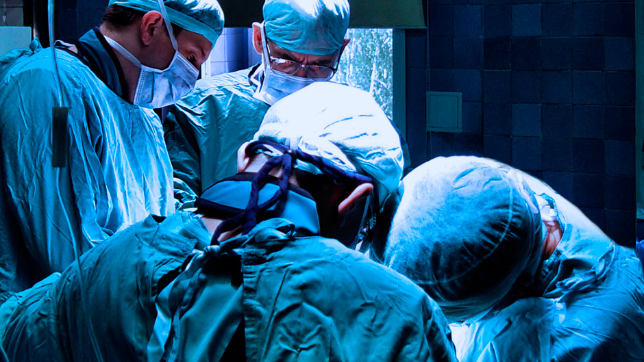 Doctors conducting surgery