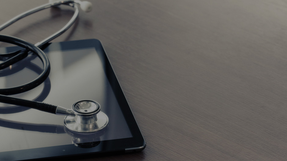 Stethoscope laying on a tablet