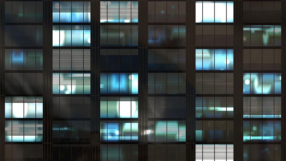 Office skyscraper windows at night