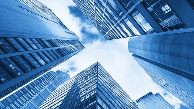 Blue building, sunny skies
