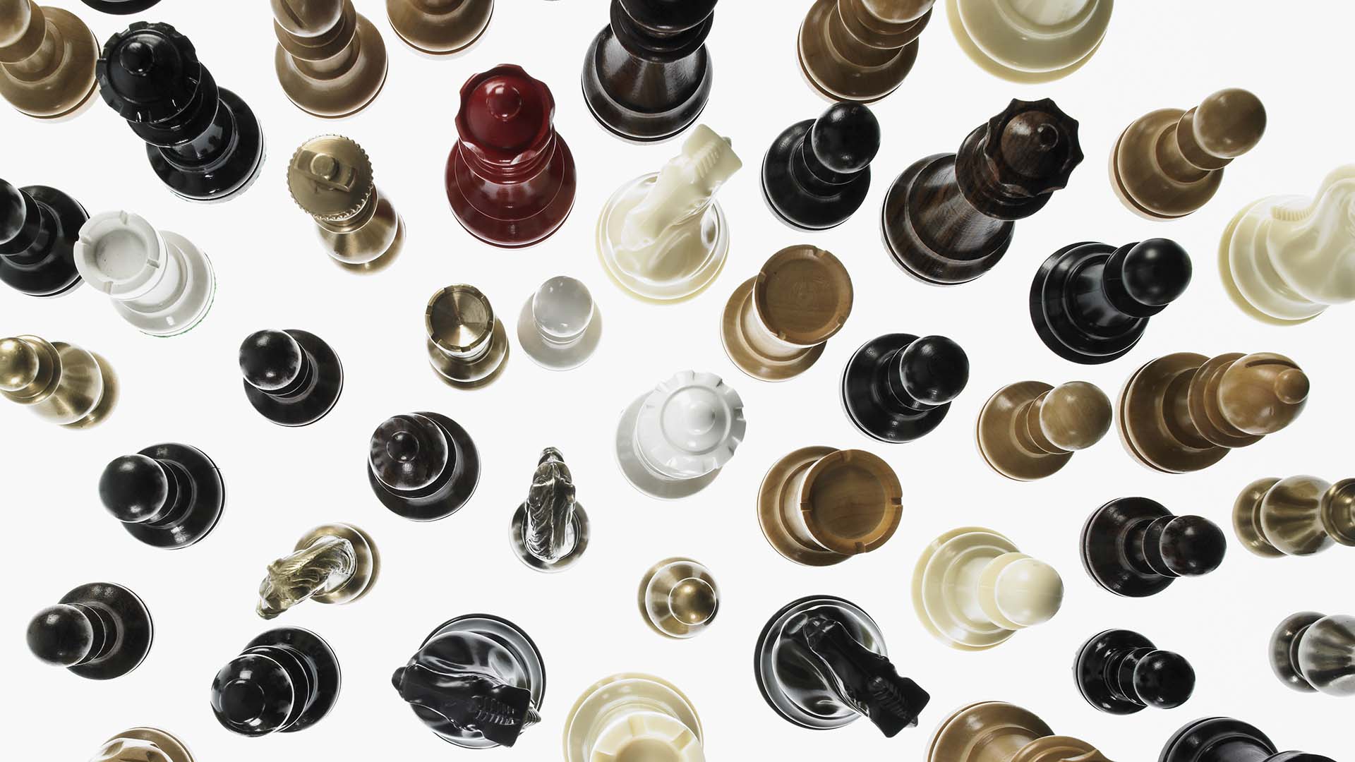 Chess pieces lined on white table