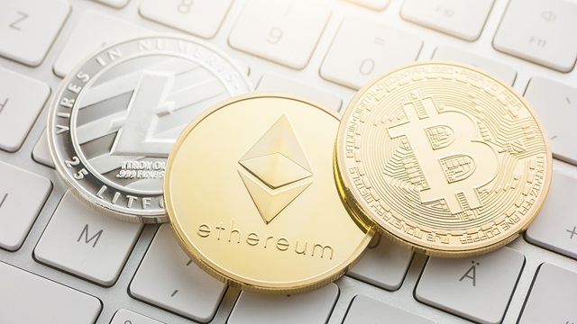 Cryptocurrency coins on keyboard