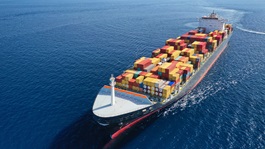 ship carrying containers in the sea