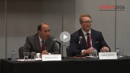 2 speakers at a panel presentation