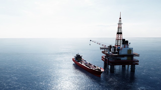 A ship docks with an oil platform