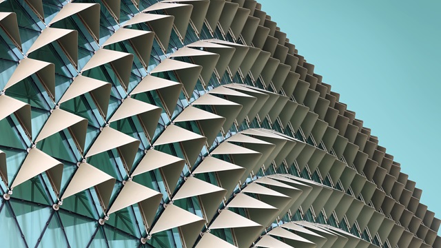 Abstract close-up view of modern aluminum ventilated facade of triangles