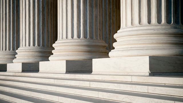 Abstract-view-of-neoclassical-fluted-columns-bases-and-steps-of-the-US-Supreme-Court-building-in-Washington-DC