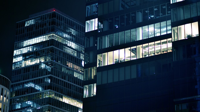 pattern-of-office-buildings-windows-illuminated-at-night