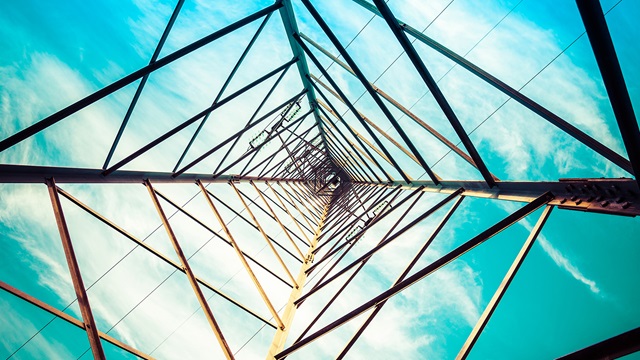 power-and-utilities-silhouette-shot-ofselectricity-pylons-with-cloudy-sky